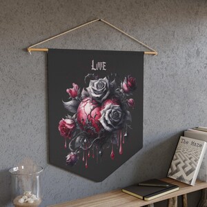 May include: Black banner with a heart and roses design. The heart is red with a cracked texture, surrounded by gray and red roses. The word "LOVE" is at the top in a gothic font. The banner is hanging on a wooden rod.