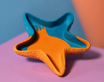 Vassoio portaoggetti a forma di stella marina blu e arancione