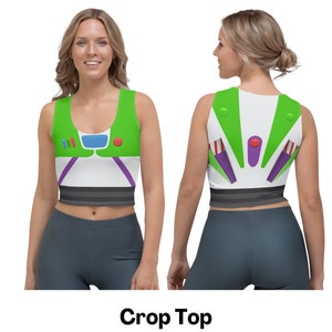 May include: A green, white, and purple crop top with a cartoon image of Buzz Lightyear from the Toy Story movie franchise. The crop top has a black waistband.