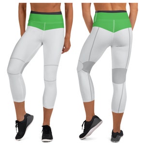 May include: White and green capri leggings with gray knee pads. The leggings have a high waist and a wide waistband.