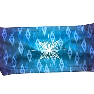 May include: A blue and purple headband with a white snowflake pattern. The headband is made of a soft, stretchy material and is perfect for keeping hair out of your face.
