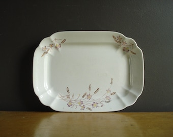May include: White rectangular serving platter with a scalloped edge and a floral design in shades of purple, brown, and yellow.