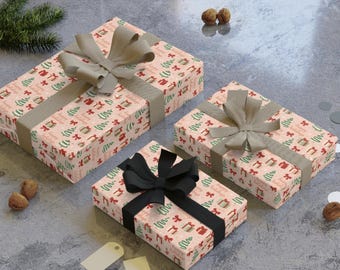 Rollo de papel de regalo navideño, acabado satinado de origen sostenible.