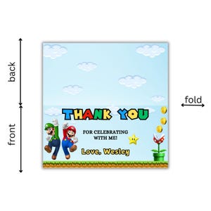 May include: A thank you card featuring Mario and Luigi characters from the Super Mario Bros. video game. The card has a blue sky background with white clouds and a green grassy foreground. The text on the card reads "THANK YOU" in colorful letters, "FOR CELEBRATING WITH ME!" and "Love, Wesley".