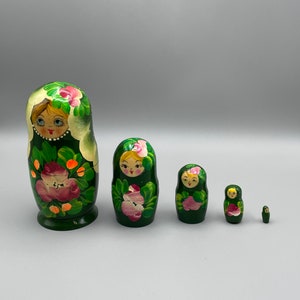 Vintage Russian Matryoshka nesting stacking dolls in green floral dresses made in Russia