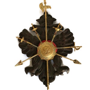 Vintage medieval decor Knight decoration coat of arms insignia on carved wooden plaque with letter opener swords and spears