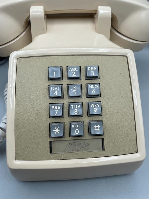 ヴィンテージベージュプッシュボタン電話、1980年代のベルシステム 