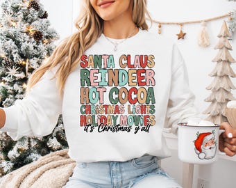 Christmas Santa Claus Shirt and Sweatshirt, Santa Claus, Reindeer, Hot Cocoa, Christmas Lights, Holiday Movies, It is Christmas Y'all Logo.