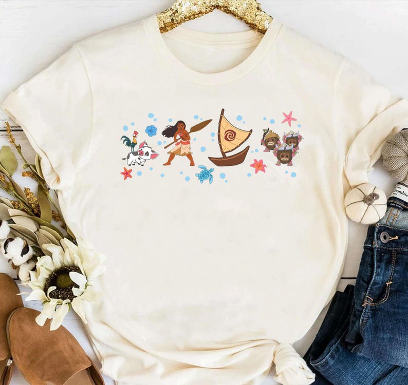 May include: A white ceramic mug with a black handle and the text "But First, Coffee" in a handwritten style. The mug is on a white surface. The mug is 10 cm tall.