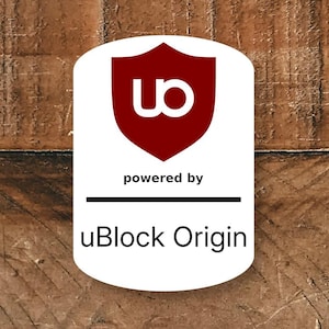May include: A white and red logo with the text "powered by uBlock Origin" on a wooden background. The logo features a red shield with a white "ub" symbol.