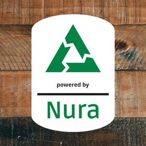 May include: A white rectangular label with rounded corners featuring a green triangular recycling-style symbol at the top. Below the symbol, the text reads "powered by" in black, followed by a horizontal black line and the green word "Nura".