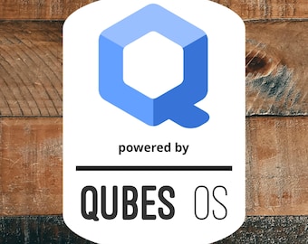 May include: A white rectangular sticker with rounded corners featuring a blue geometric cube icon at the top. Below the icon, the text reads "powered by" in black, followed by a horizontal line and the text "QUBES OS" in black.