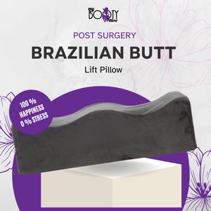 May include: Gray post-surgery lift pillow with a curved shape. The pillow is on a white surface and has the text "100% HAPPINESS 0% STRESS" on it. The text "POST SURGERY BRAZILIAN BUTT Lift Pillow" is above the pillow.