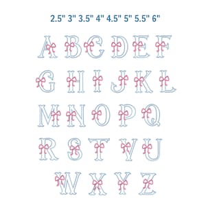 May include: A full alphabet in a light blue font with pink bows. The letters are displayed in a grid, with measurements in inches at the top. The letters are stylized with a decorative design.
