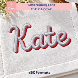 May include: An embroidery font design featuring the name Kate in a cursive script. The letters are stitched in light gray with a bold red shadow outline. The text is displayed on a white fabric background with the label 6 Sizes 1" 1.5" 2" 2.5" 3" 3.5" and +BX Formats.