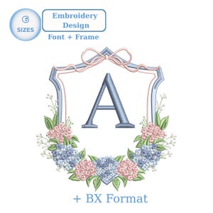 May include: An embroidery design featuring a light blue letter "A" within a shield-shaped frame, adorned with pink and blue floral accents. The design includes the text "Embroidery Design Font + Frame" and "+ BX Format".