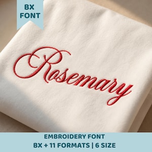 May include: A white fabric surface featuring the red embroidered name Rosemary in a cursive script font. A light blue tag in the upper left corner displays the text BX FONT, while the bottom blue banner reads EMBROIDERY FONT BX + 11 FORMATS | 6 SIZE.