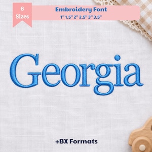May include: An embroidery font design featuring the word Georgia stitched in blue thread on white fabric. The text includes 6 sizes: 1 inch, 1.5 inches, 2 inches, 2.5 inches, 3 inches, and 3.5 inches. The design also includes BX formats for digital use.