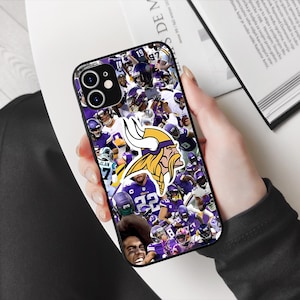 May include: A black phone case with a collage of Minnesota Vikings players and logos. The case features a large purple and gold Viking helmet with horns.
