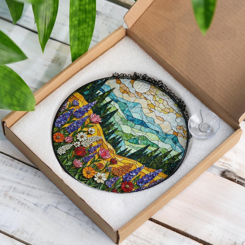a box with a picture of a forest inside of it