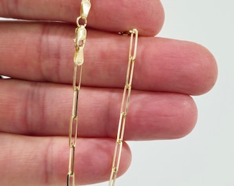 May include: A gold chain bracelet with a box chain design. The bracelet is made of 14k gold and has a lobster clasp closure.