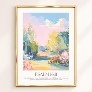 Op de afbeelding: Een ingelijste kunstdruk met een impressionistisch landschapsschilderij met zachte roze, blauwe, gele en groene penseelstreken. Onder het kunstwerk staat de tekst: PSALM 16:11. You make known to me the path of life. You will fill me with joy in your presence, with eternal pleasures at your right hand.