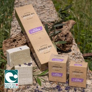 May include: A selection of lavender soap and packaging. The image shows rectangular soap bars and boxes of different sizes, all labelled with "LAVANDE BIO Berenger VALENSOLE". The packaging is brown with purple details.