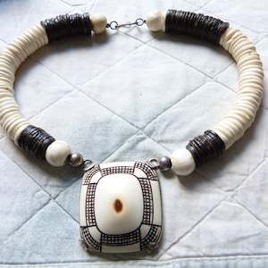 Namibia Ovambo Omakipa button, dress ornament,  set in sterling silver, antique shell necklace with coconut heishi