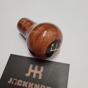 May include: A set of three ceramic mugs with a speckled, matte finish. The mugs are in shades of cream, light gray, and dark gray. Each mug has a simple, minimalist design, perfect for coffee or tea.