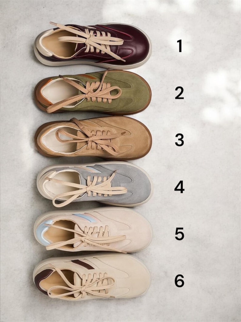 May include: Six pairs of sneakers in different colors and styles. The sneakers are arranged vertically from top to bottom, with the numbers 1 through 6 next to each pair. The sneakers are all low-top and have laces.