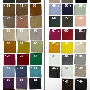 May include: A color chart with suede and leather swatches, each labeled with a number. The swatches display a variety of colors, including black, brown, blue, green, and animal prints. The brand name "ANATO STEPS" is at the bottom.