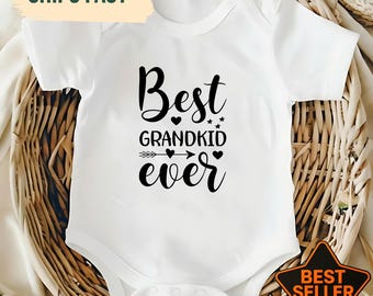 Camiseta adorable con la frase "El mejor nieto del mundo", anuncio de un nuevo nieto, regalo para abuelos, regalo de los nietos, camiseta familiar divertida, abuelo orgulloso.