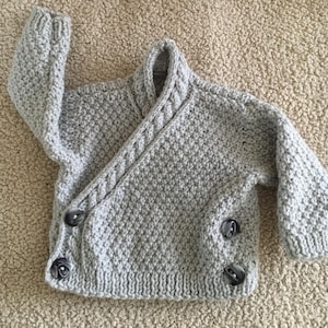 Hand knitted baby cardigan