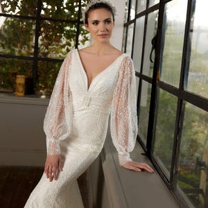 Beaded Lace Mermaid Wedding Dress: Long Sleeve Open Back Corset Gown