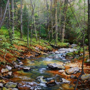 May include: A white ceramic mug with a black handle and the text "But First, Coffee" in a bold, black font. The mug is set against a blurred background, suggesting a cozy setting.