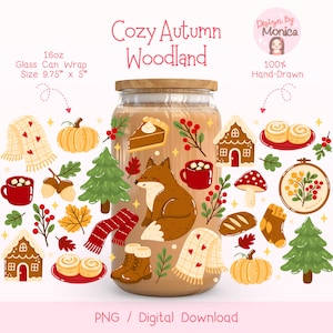 May include: A glass can wrap with a wooden lid, featuring a "Cozy Autumn Woodland" design. The design includes a fox, pumpkins, a scarf, and other fall-themed illustrations. The can wrap is 9.75" x 5" and holds 16oz. The design is hand-drawn.