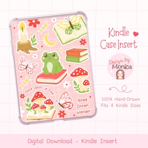 May include: A clear Kindle case insert with a pink grid pattern, featuring whimsical illustrations of a frog, mushrooms, butterflies, books, and a candle. Text includes "Kindle Case Insert," "Once Upon a Time," and "Read Dream Wander."