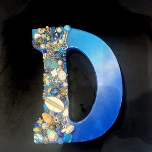 Arte de joyería hecho a mano Letra D