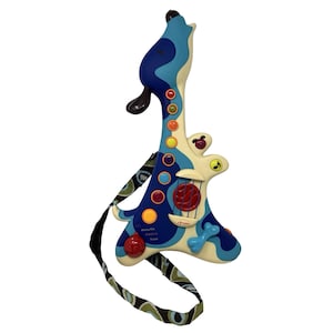 May include: A blue, white, and tan toy guitar shaped like a howling dog. The guitar has colorful buttons, a red sound hole, and a black and green patterned strap. The text "acoustic electric howl" is visible.
