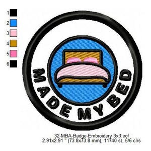 May include: A black and white embroidered patch with a blue circle in the centre. The circle contains a bed with a pink blanket and pillows. The text "MADE MY BED" is written around the circle.