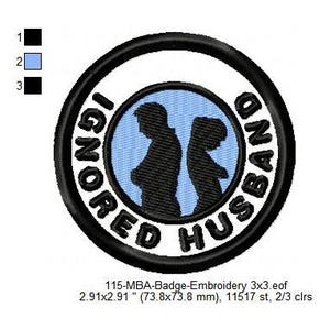 May include: A black and white embroidered patch with a blue background. The patch is round and features two figures standing back to back. The text "IGNORED HUSBAND" is written around the figures in a circle.