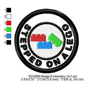 May include: A black and white embroidered patch with the text "STEPPED ON A LEGO" in a circle. The patch features a design of three LEGO bricks in red, green, and blue.