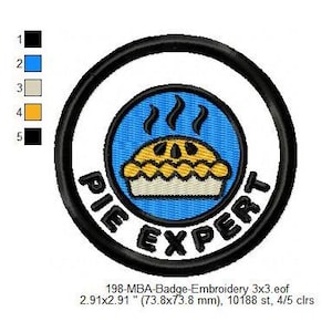 May include: A black and white embroidered patch with a blue background. The patch features a pie with a yellow crust and a brown filling, with steam rising from the top. The text "PIE EXPERT" is written in a black circle around the pie.