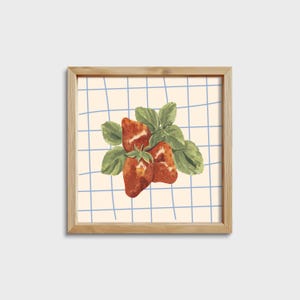 May include: A framed illustration of three red strawberries with green leaves on a blue and white checkered background.
