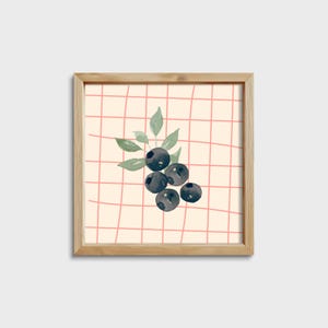 May include: A framed print of a watercolor painting of blueberries with green leaves on a pink and white checkered background.