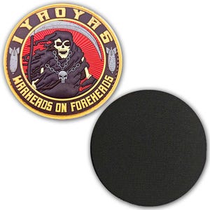 May include: A round patch with a grim reaper design. The patch features a skull with a scythe, chain, and the text "IYHOYAS WARHERDS ON FOREHEADS". The patch is brown, red, and yellow with a black circular coaster.