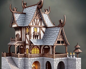 May include: A detailed model of a fantasy house with a stone base, wooden beams, and a gray tiled roof. The house features multiple levels, balconies, and arched openings. The Maker Man3D logo is visible in the top right corner.
