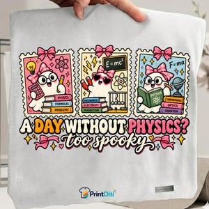 May include: A white t-shirt featuring three postage stamp-style illustrations of ghosts with pink bows, surrounded by physics-themed icons and books. The text reads A DAY WITHOUT PHYSICS? too spooky. The design includes calculators, magnets, and globes.