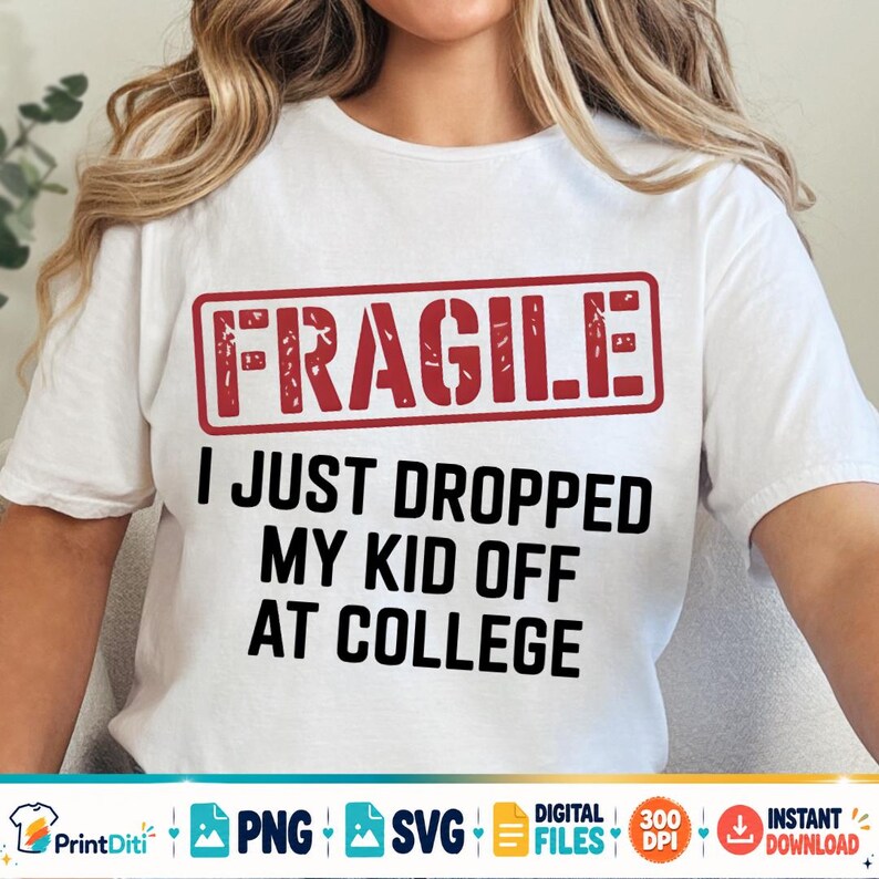 May include: A white short-sleeved t-shirt featuring a red rectangular stamp graphic with the word FRAGILE in distressed lettering. Below the stamp, the black text reads I JUST DROPPED MY KID OFF AT COLLEGE in a bold, sans-serif font style.