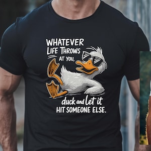 May include: Black t-shirt with a white graphic of a duck wearing sunglasses and the text "Whatever life throws at you, duck and let it hit someone else."